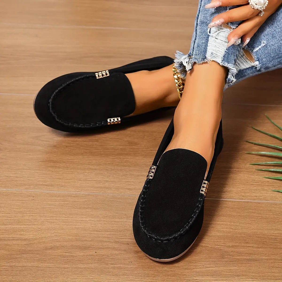 Whisper-soft loafers on a model, paired with tailored jeans.