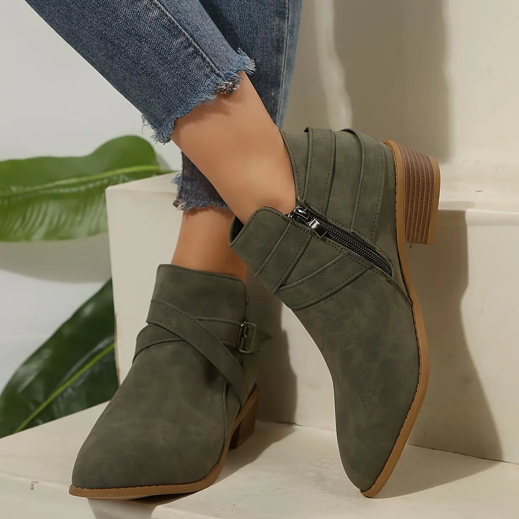 Side view of olive block heel boots showcasing sturdy block heel.